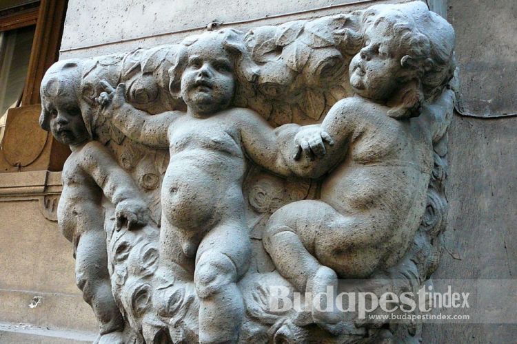 Its façade is decorated with the dancing putti and heads of Hermes of Baroque art.
