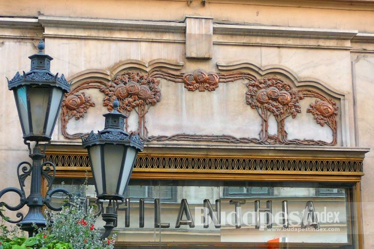 Philanthia flower shop was designed in 1906. Its marble shopwindow is decorated with brass rose bushes.